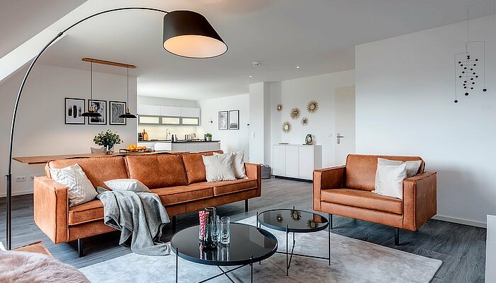 [Translate to japanisch:] Eingerichtetes Wohnzimmer